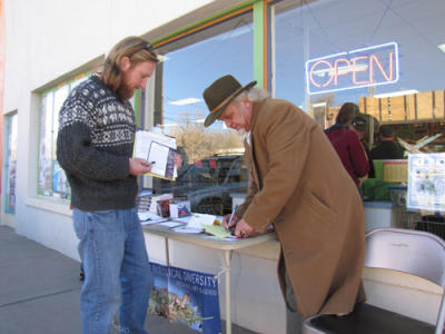 Brett Haverstack staffs a Mexican wolf information table in Silver City